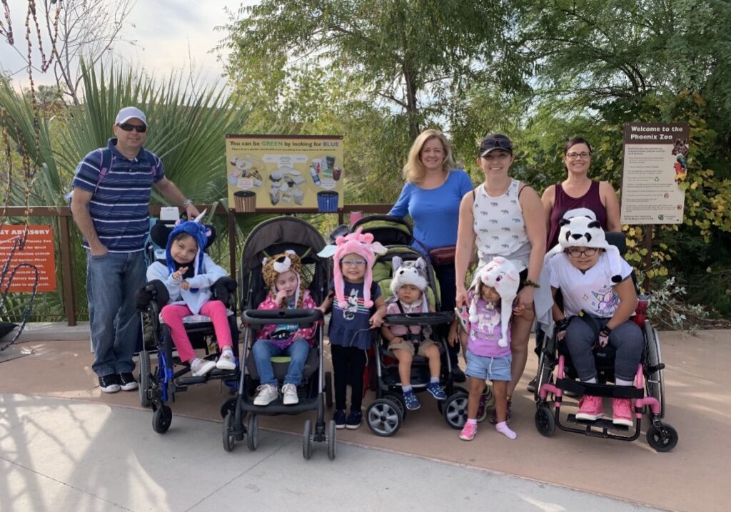 Group of children and adults at zoo.
