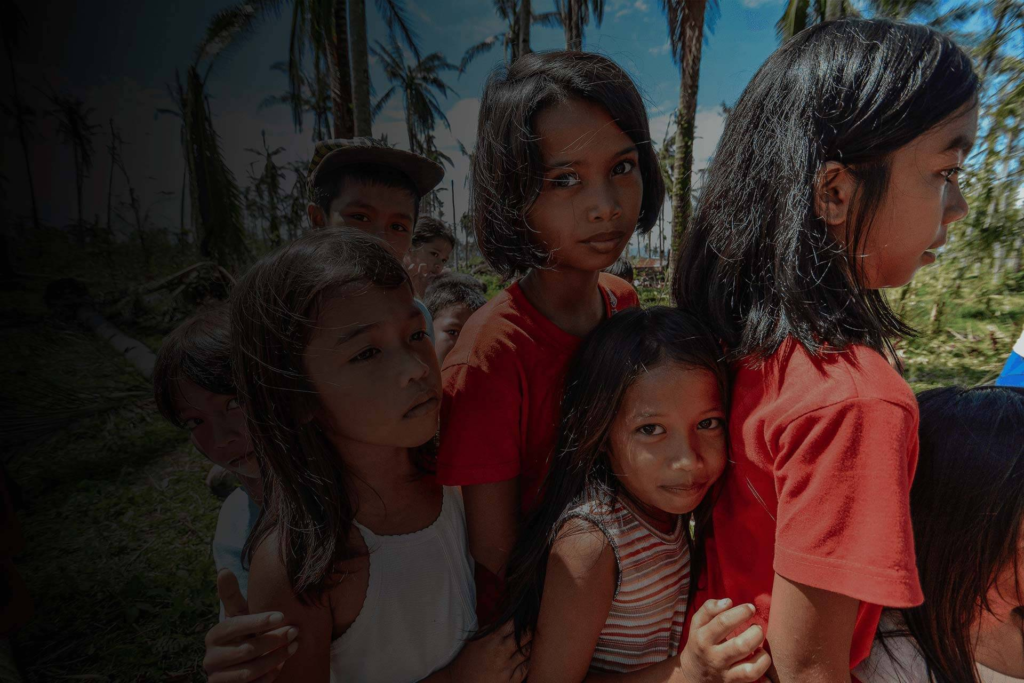Children standing together in a calm environment.